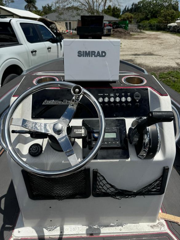 Action Craft helm fitted with a Simrad display, stereo head unit and new switch panel