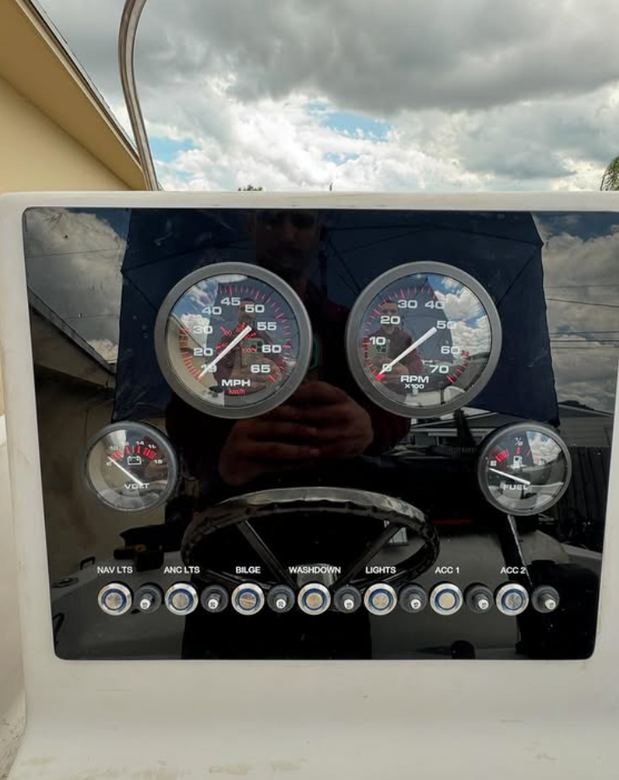 Restored gauge cluster and lit switch panel on a center console dash