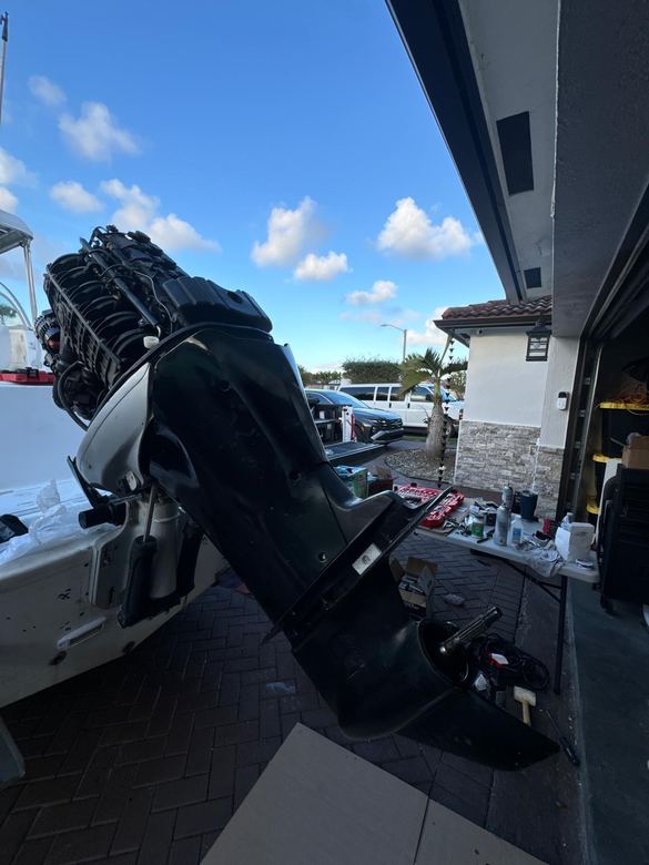 Outboard with the cowling removed for powerhead diagnostics and repair